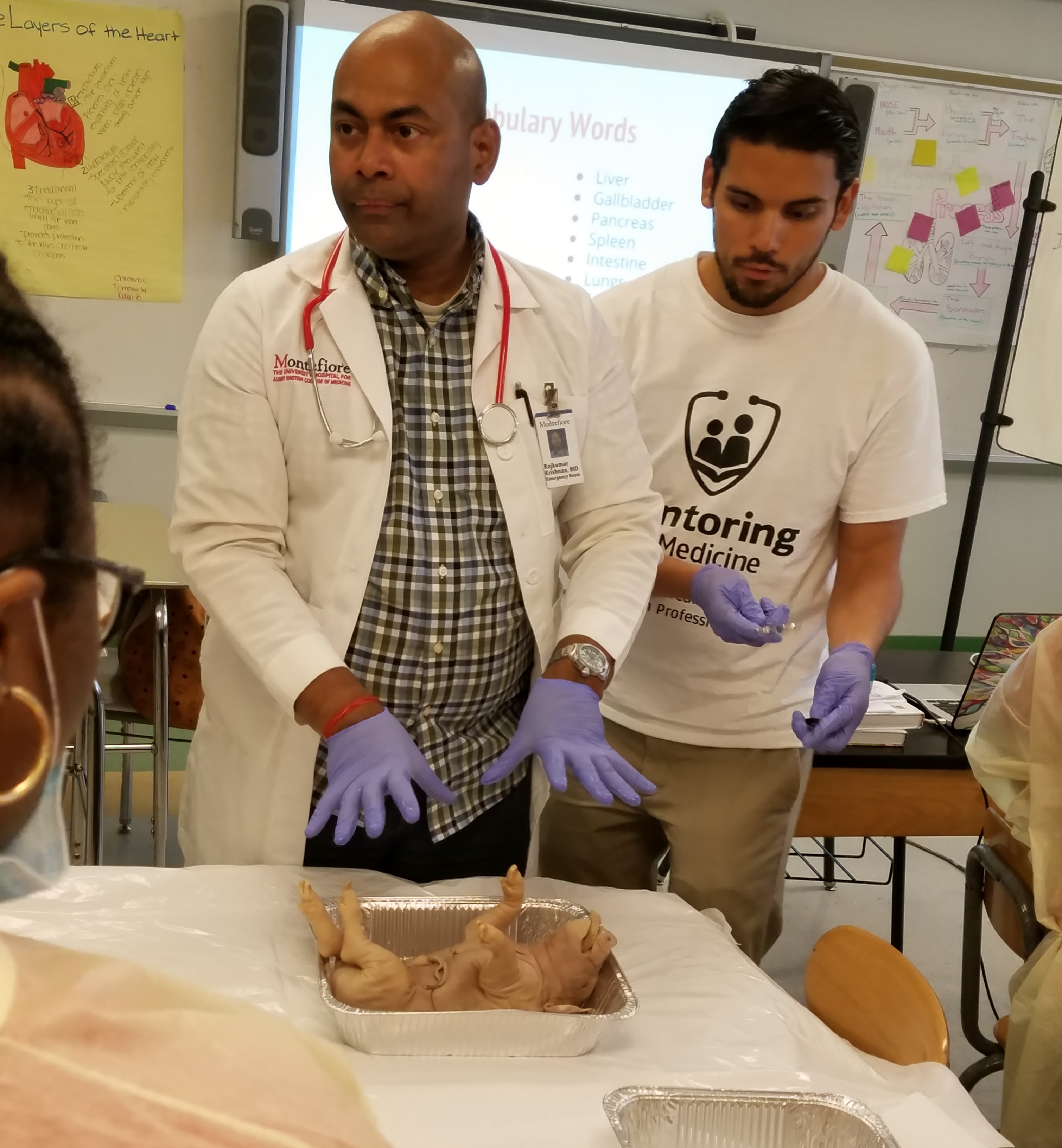 Dr. Raj Krishnan instructing the students on how to conduct their autopsy to determine cause of death. Dr. Raj Krishnan instructing the students on how to conduct their autopsy to determine cause of death.