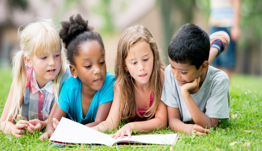 Children Reading Outdoors