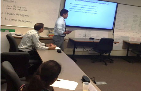 TOC II student Marciano Rosales conducts a lesson on subjunctives before faculty, fellow peers, and students from Schenectady High School Clarkson university