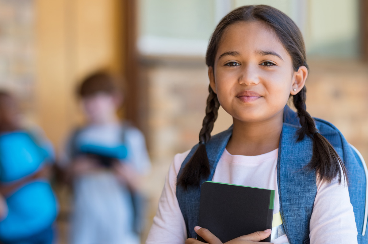 young girl wearing backpack