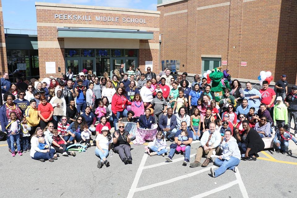 Community members gathered at the last Saturday Academy session of the 2018-19 school year. Large group of community members gathered outside Peekskill Middle School.