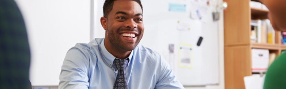 teacher at desk