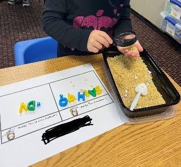 Student sorting letters