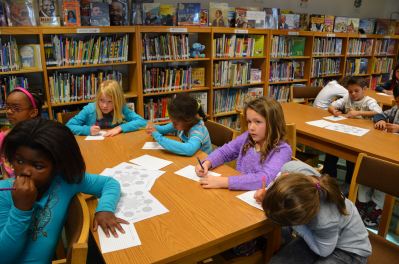 Livorno Unit School students learning about Martin Luther King Jr. celebration during a lesson held at the school library.
