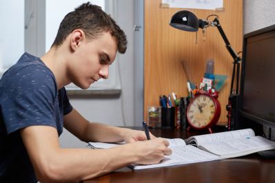 picture of teen doing homework