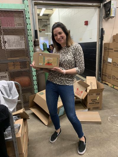 Kelly Spurduto holds a box ready for delivery