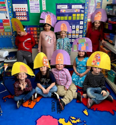 Students wearing Mayan headwear