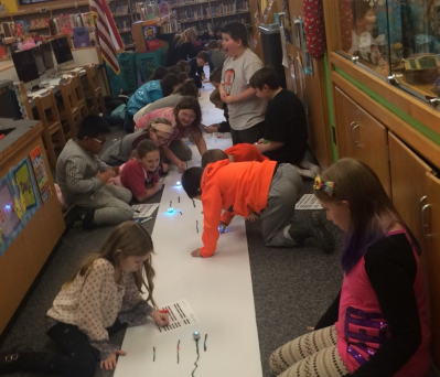Makerspace Club coding and collaborating with Ozobots