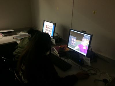 Students working on a digital art project.
