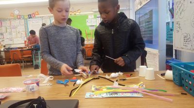 Students creating a project in a Makerspace session