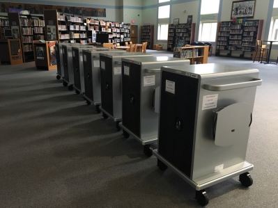 Carts with classroom sets of Chromebooks.
