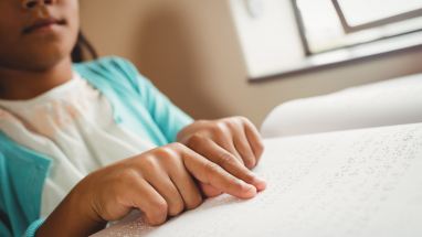 Girl reading Braille