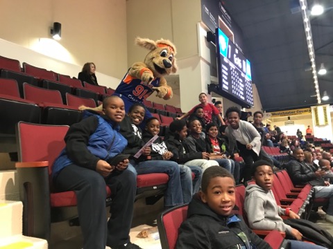 Students and their family members watch the Westchester Knicks game wkniks