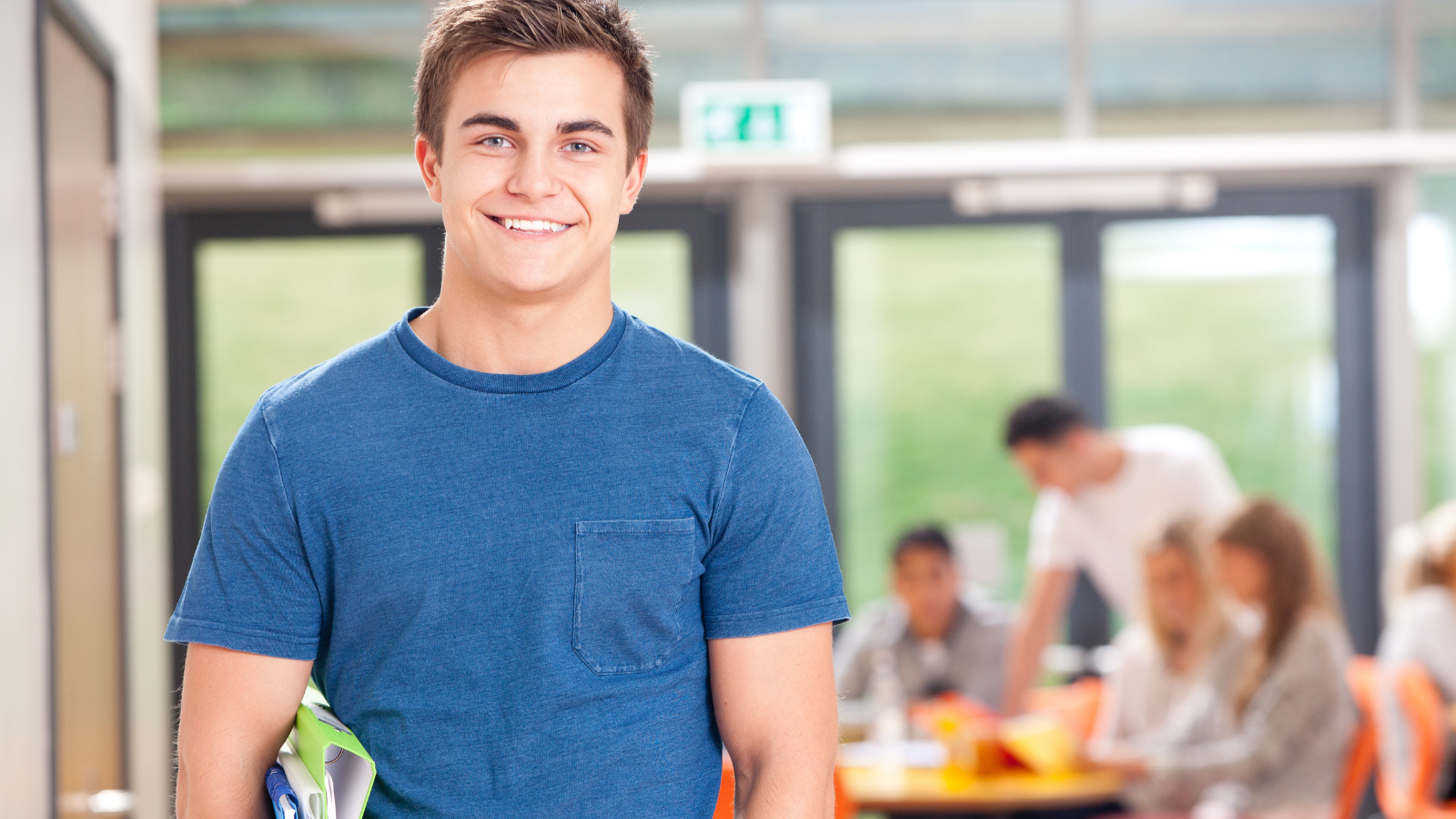 student in school with classroom in background