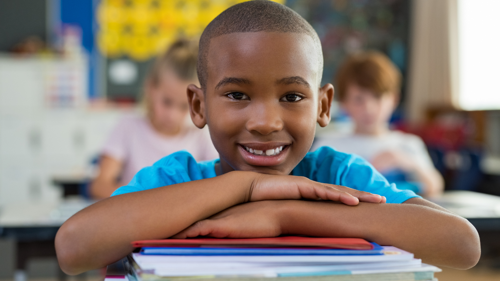 happy student with books at desk