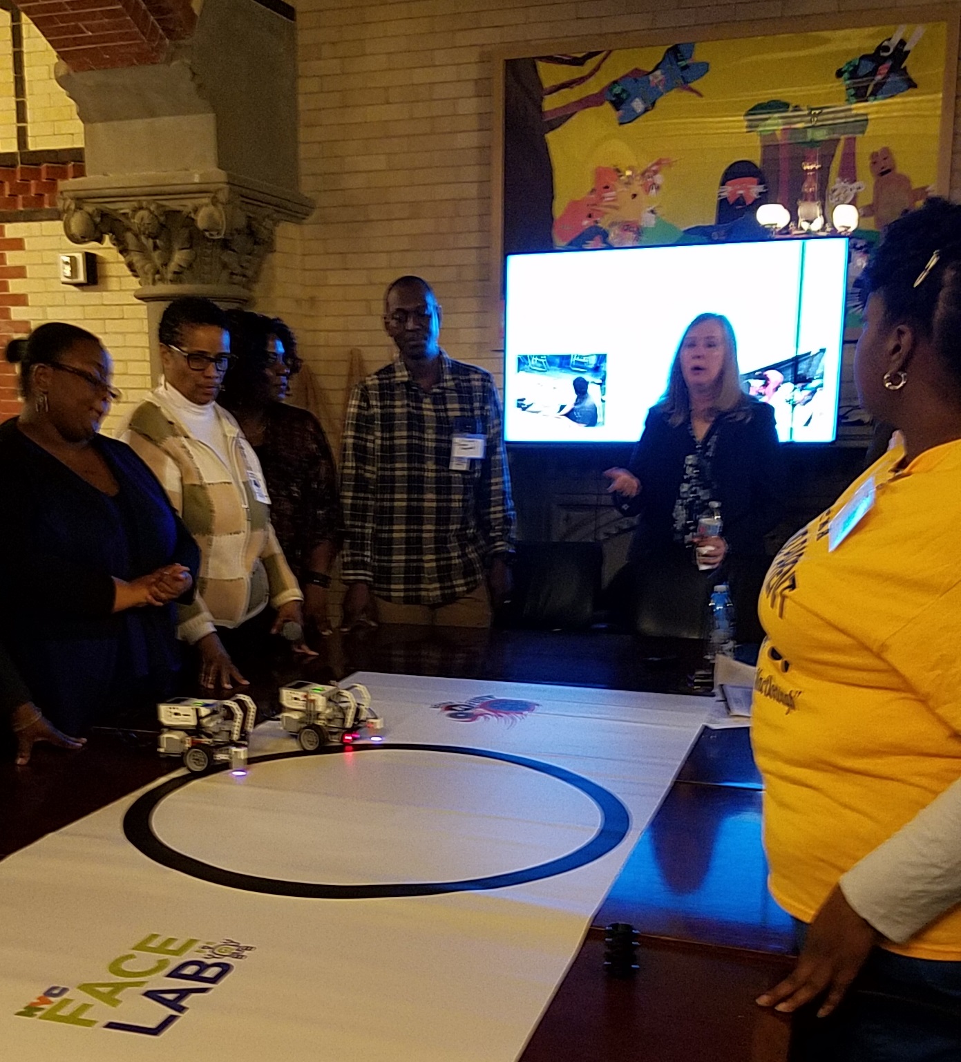 Parents and staff participating in Battle Bots demonstration