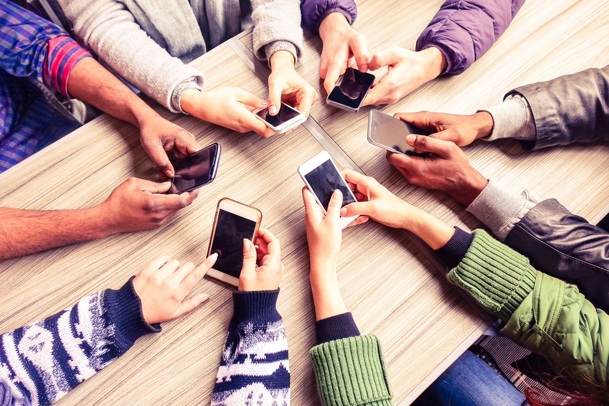 Students using cell phones.