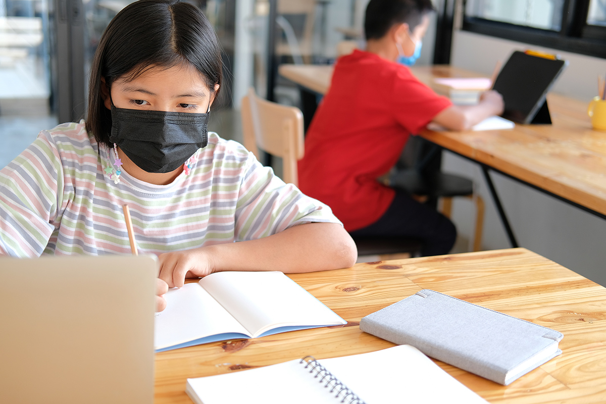Student in classroom wearing mask