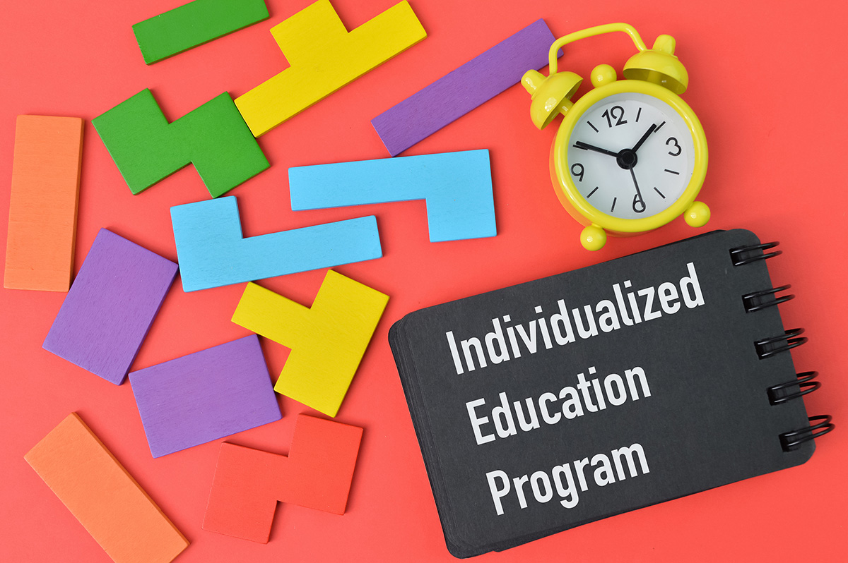 Individualized Education Program image with clock and wooden blocks