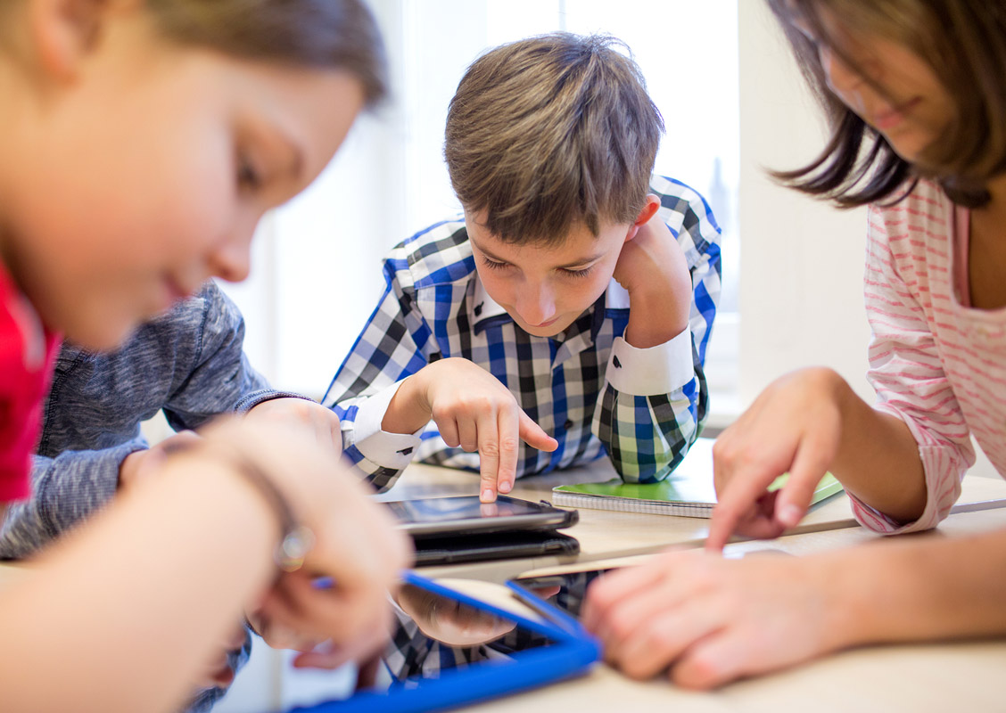 Students using devices.