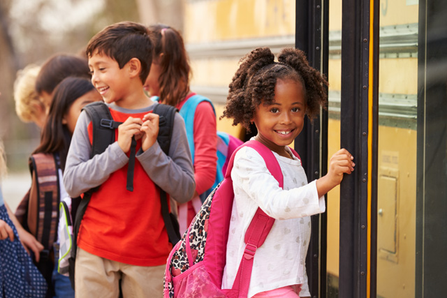 Student getting on bus