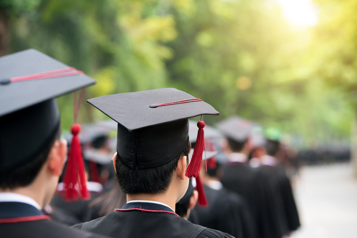 Graduates facing the sun