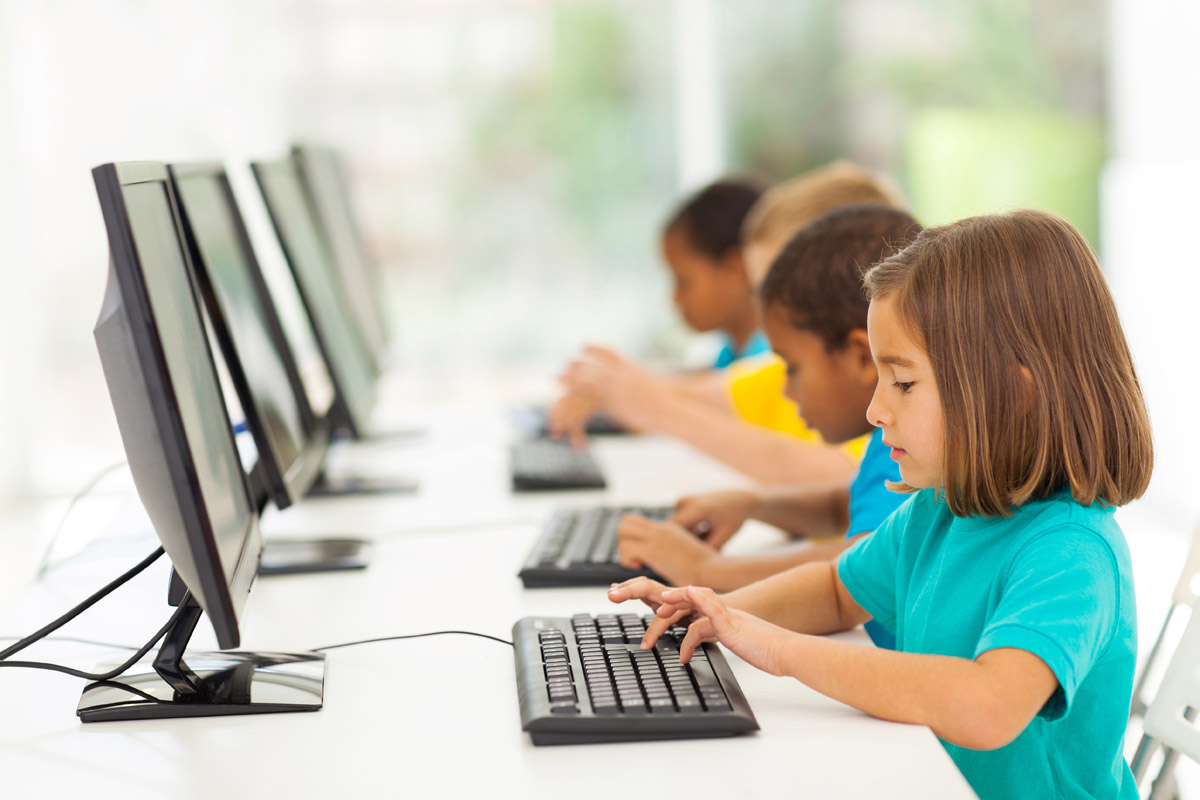 Young students using computers.