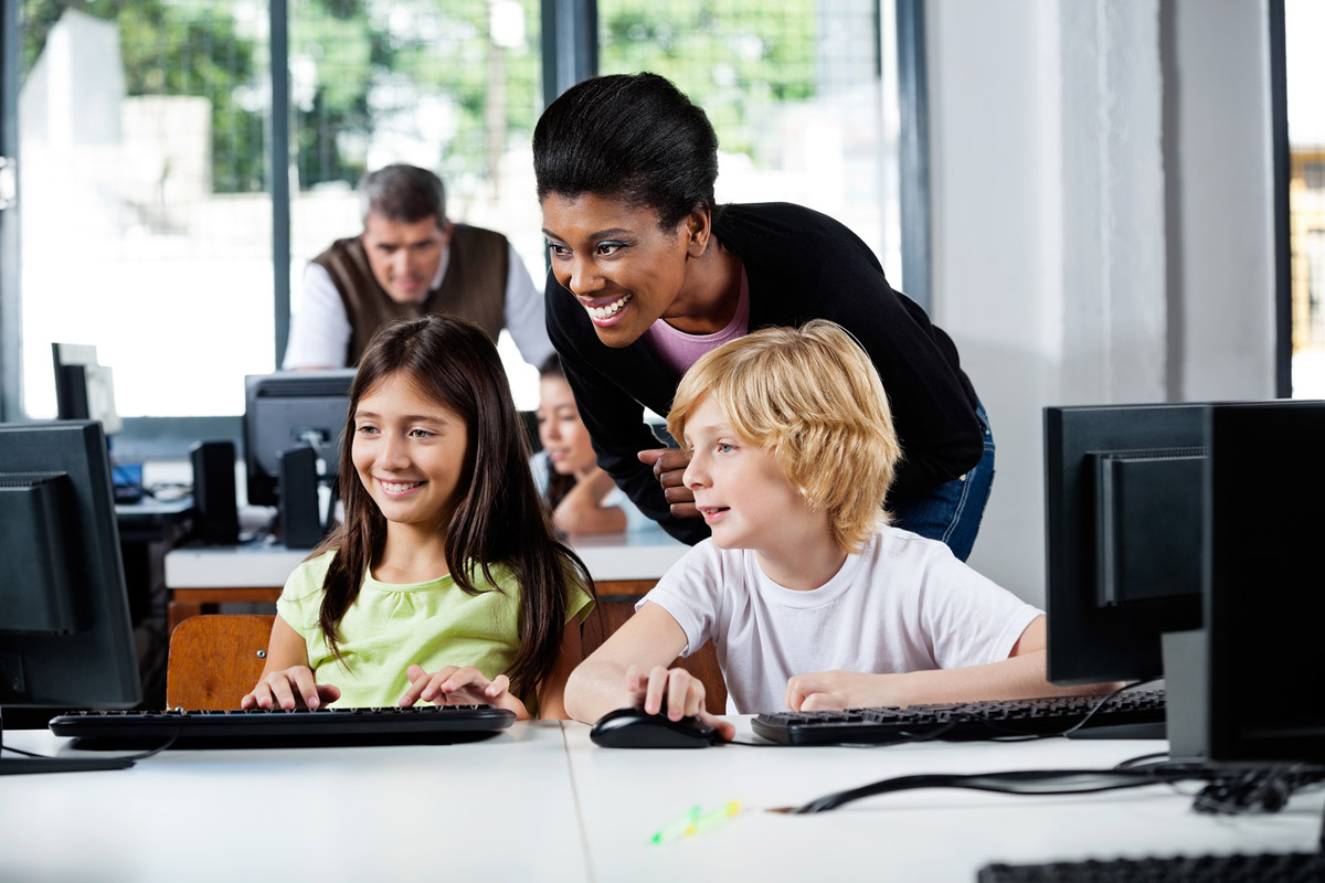 Teacher working with students