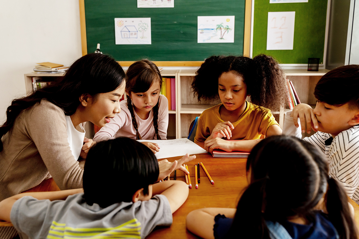 Math teacher helping students