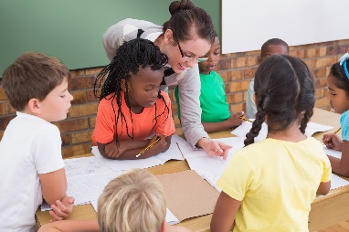 Teacher and students working