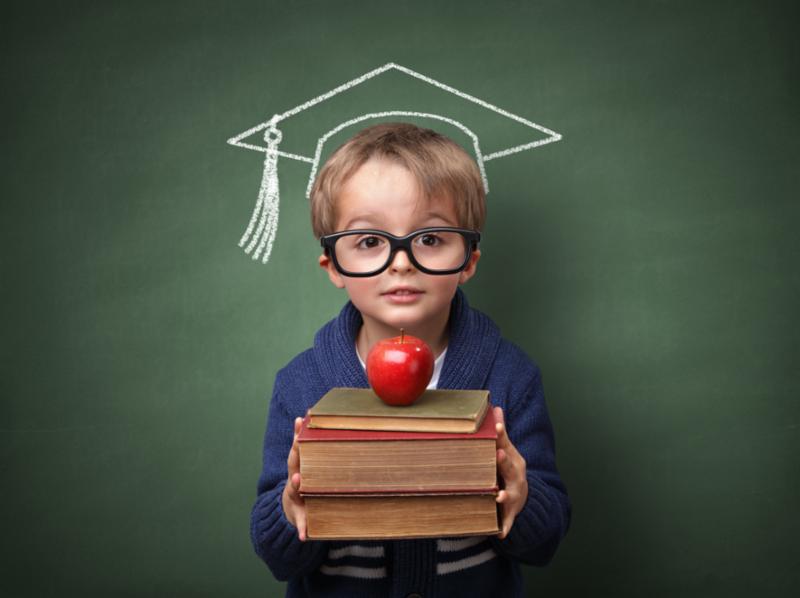 Child Holding Books