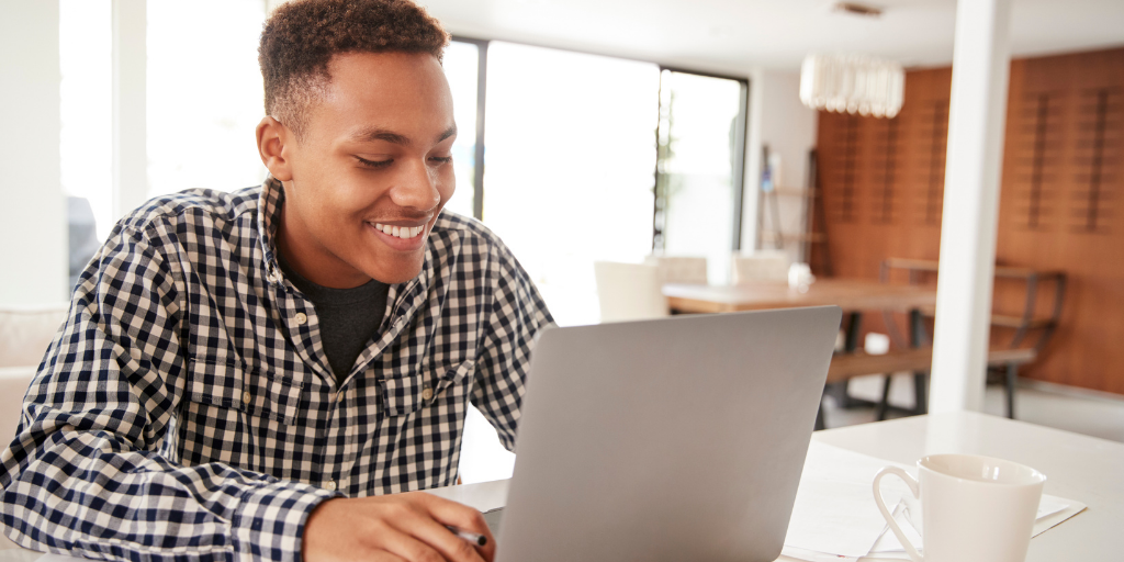 student at computer at home