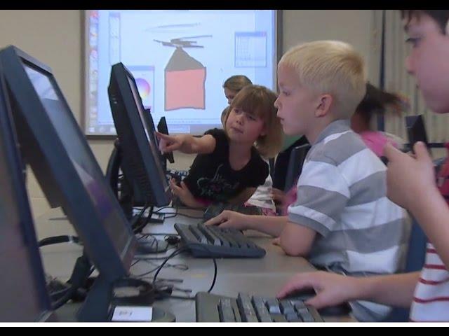 Young students working with computers