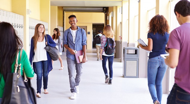 high school students walking down the hall at school