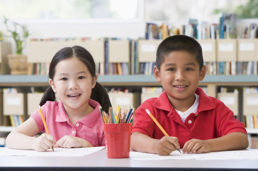 Kindergarten children sitting at desk