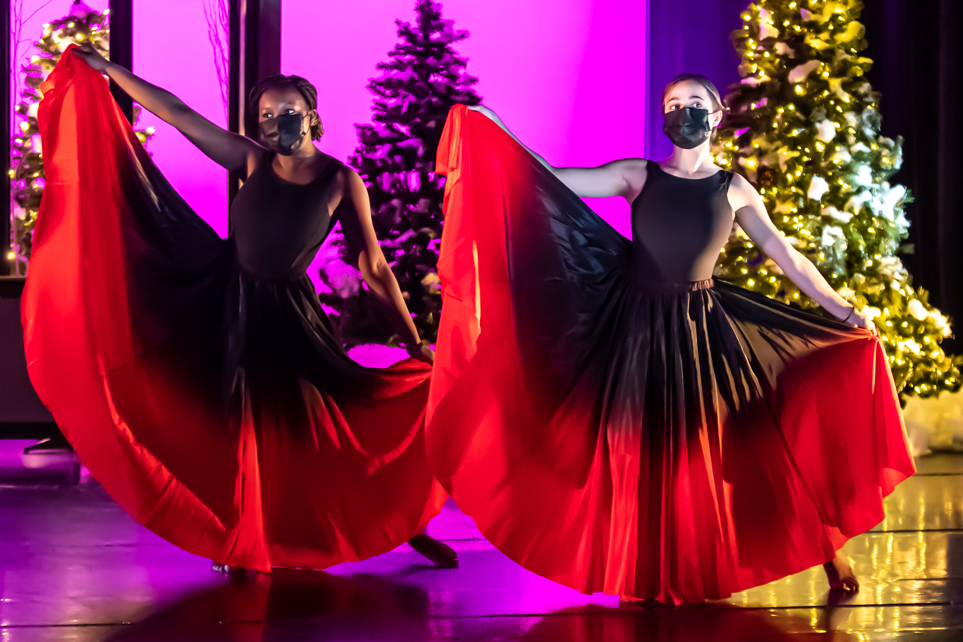 Two high school girls performing a dance routine