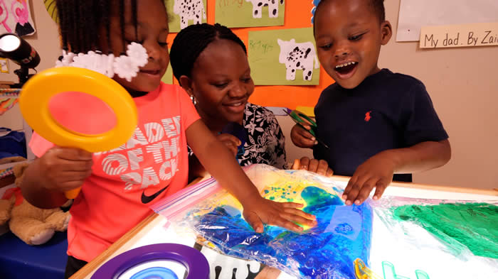 Pre-K Teacher and Children Creating Art