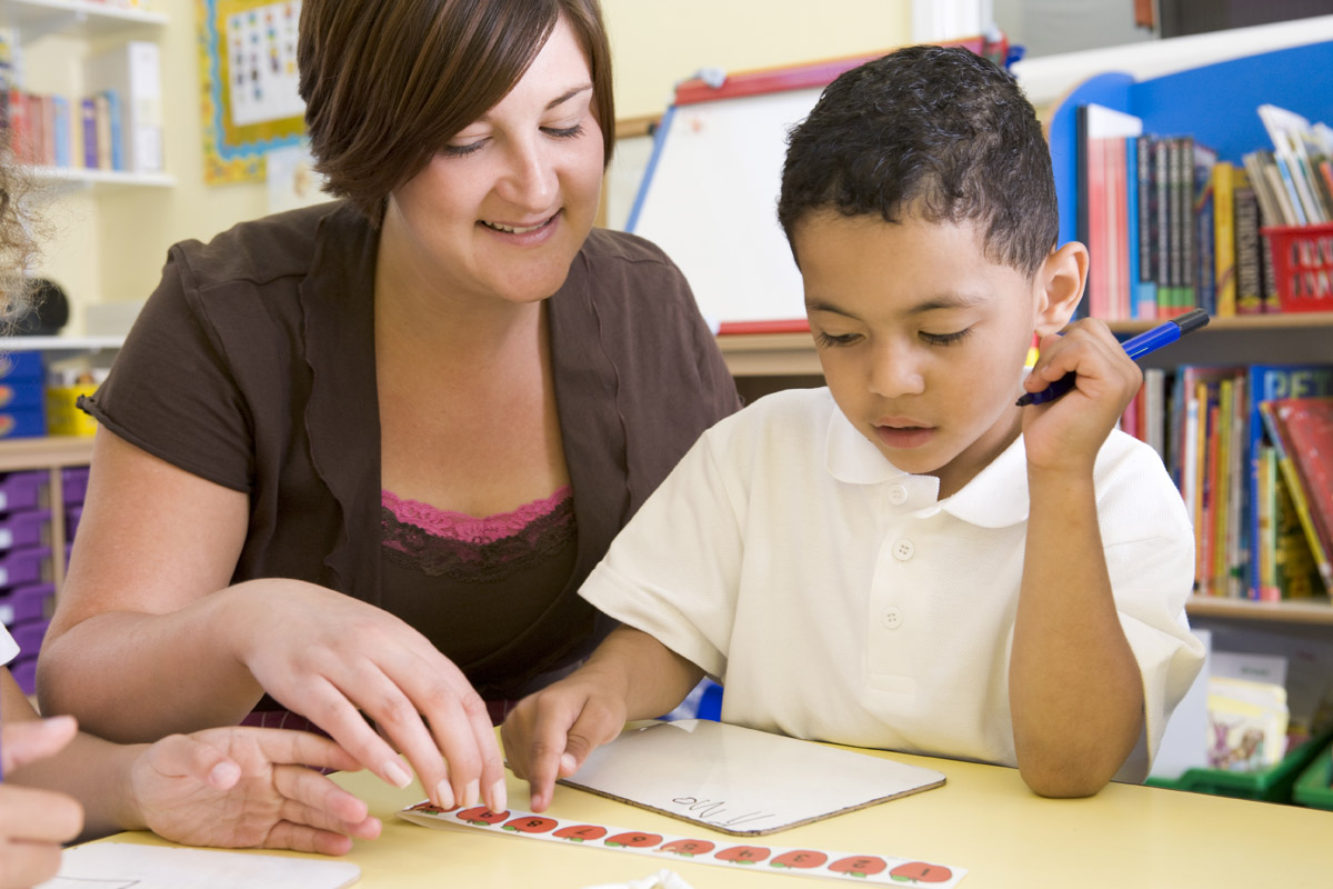 Teacher in front of students in classroom