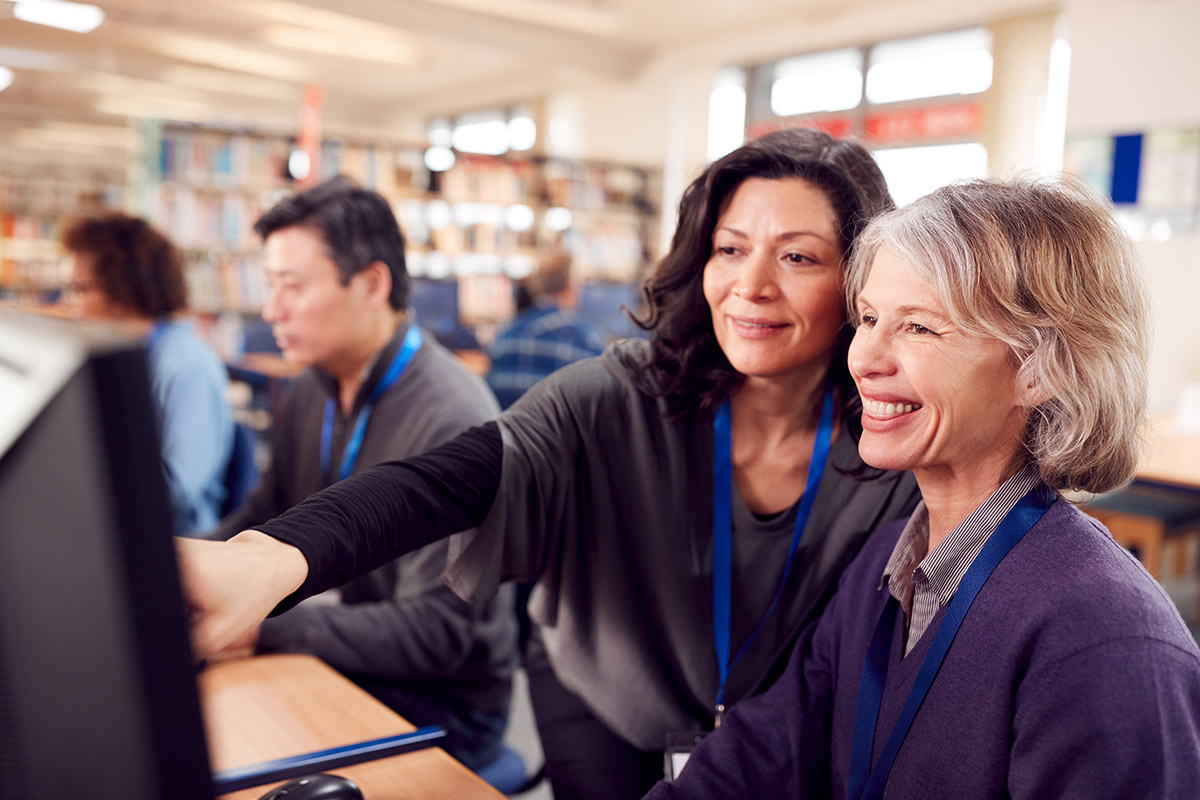 Teachers working at computers