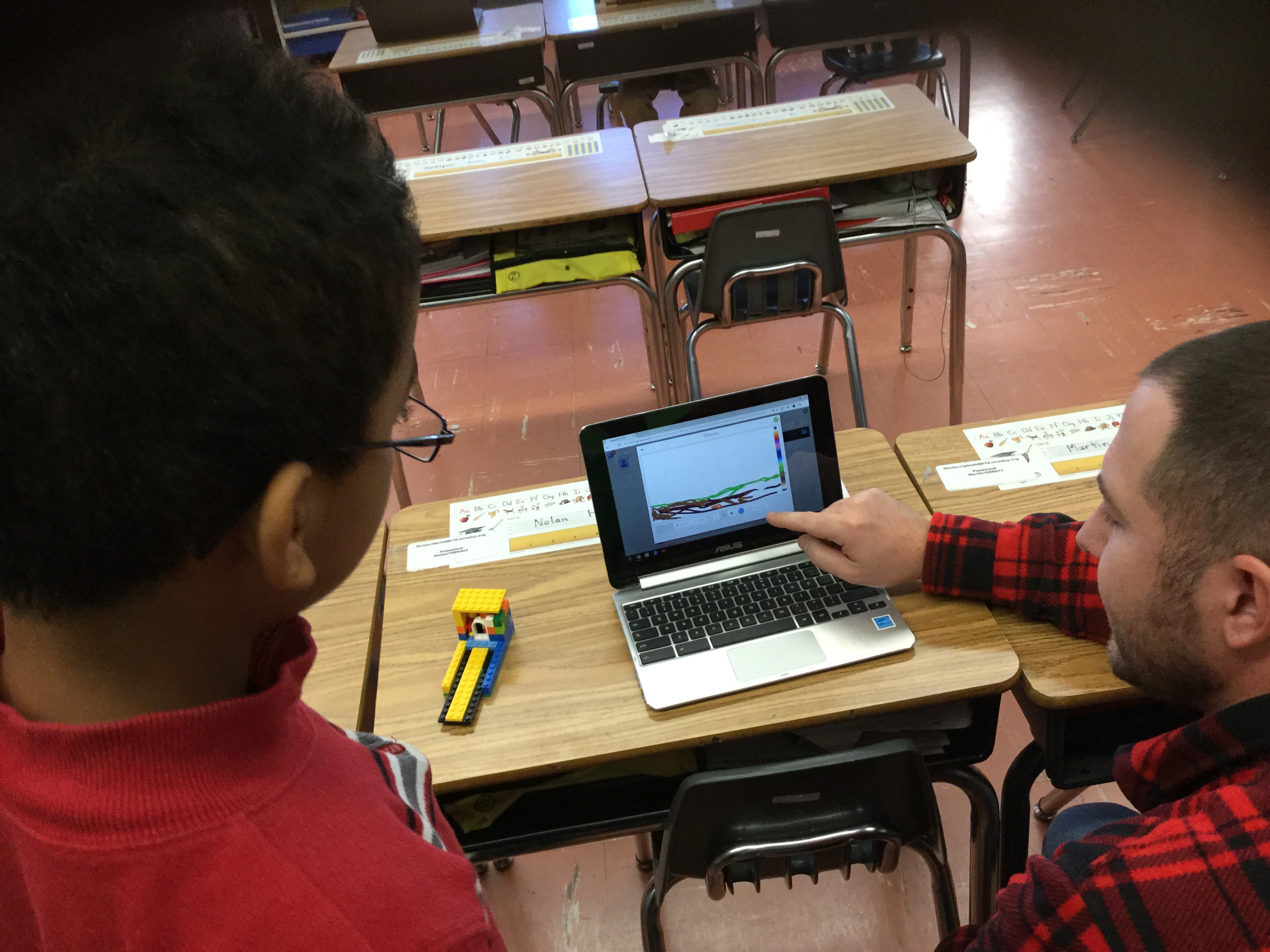 Students engaging in an activity on the computer.