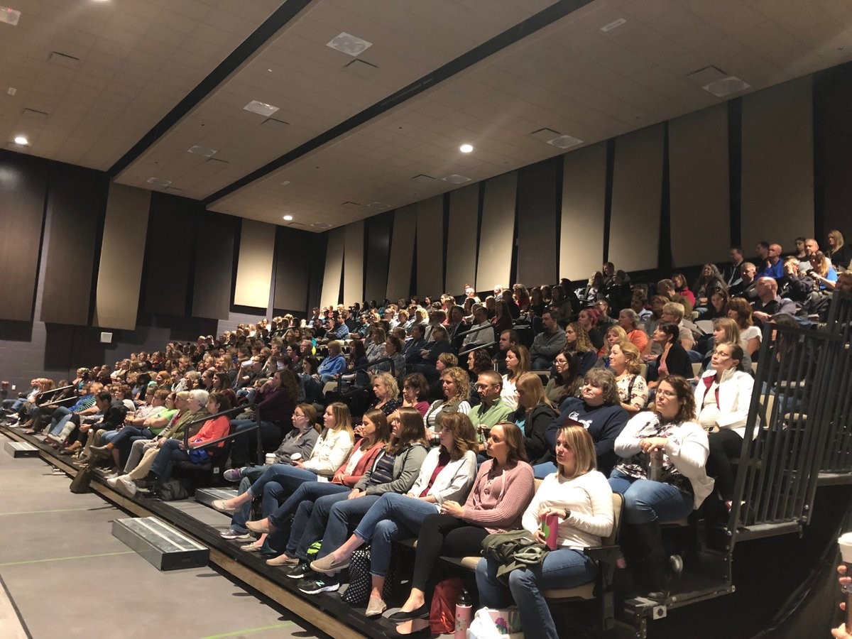 450 educators from Schoharie County schools sit in an amphitheater during a professional development day