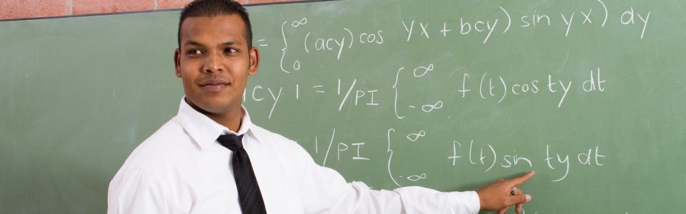 picture of teacher teaching math at chalkboard