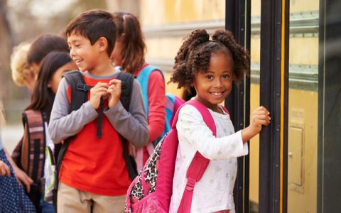 Student getting on bus