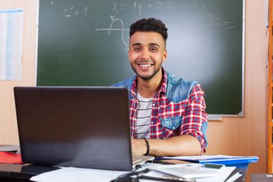 Student typing on computer