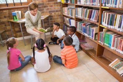 Librarian with students in library