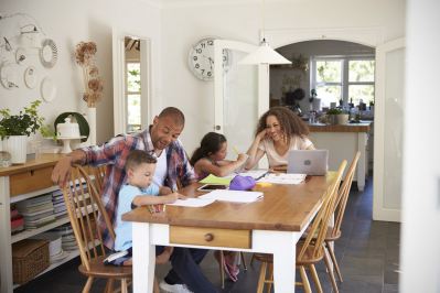 parents and children at a kitchen table