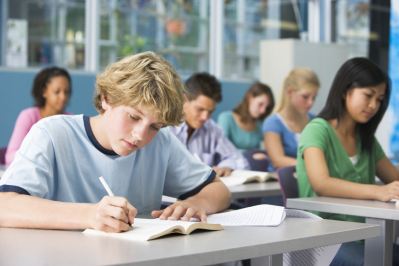 Boy working in classroom