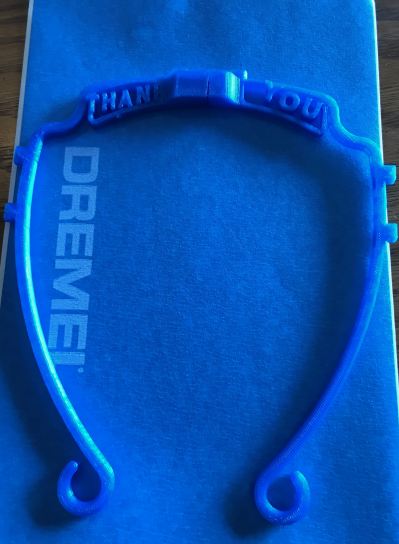 A 3D printed face mask frame with a personalized message