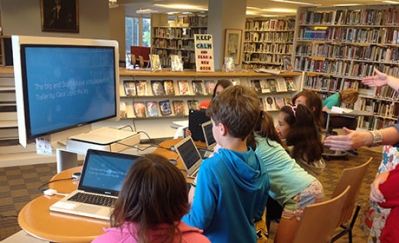 The library at Chicago's Francis W. Parker School, illustrating a flexible space with moveable chairs, desks, and bookshelves.