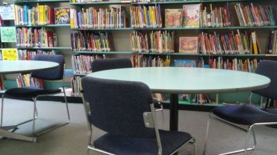 Library table and bookshelf at NYSSD